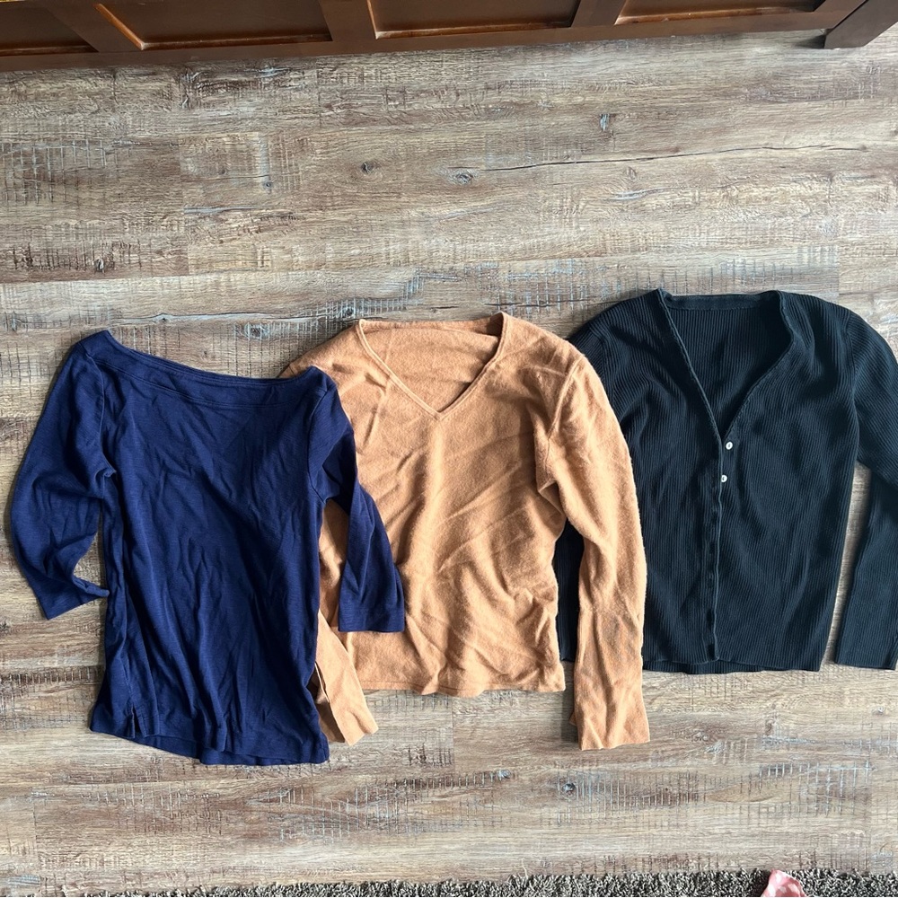 3 women’s sweaters. One has buttons